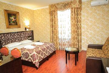 Фото номера Стандартный трехместный номер Гостиница Rosa Del Viento г. Туапсе 8